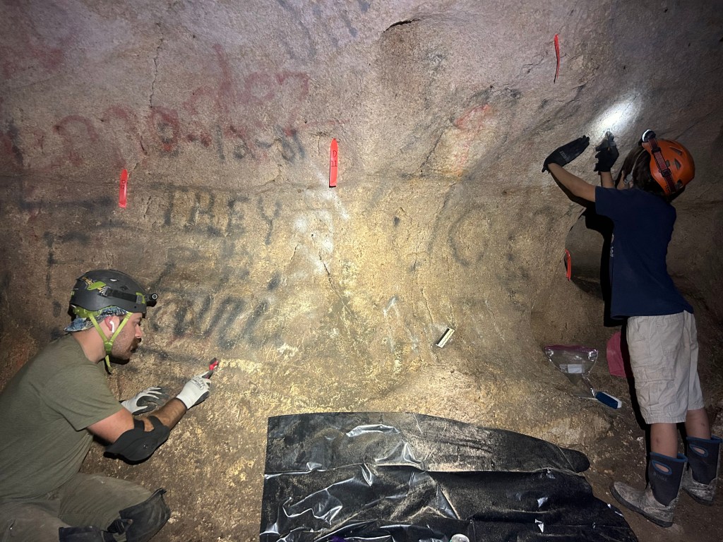 Jette P and Kraz K worked tirelessly on this section to remove crayon, carvings, and spray paint from the surface. 