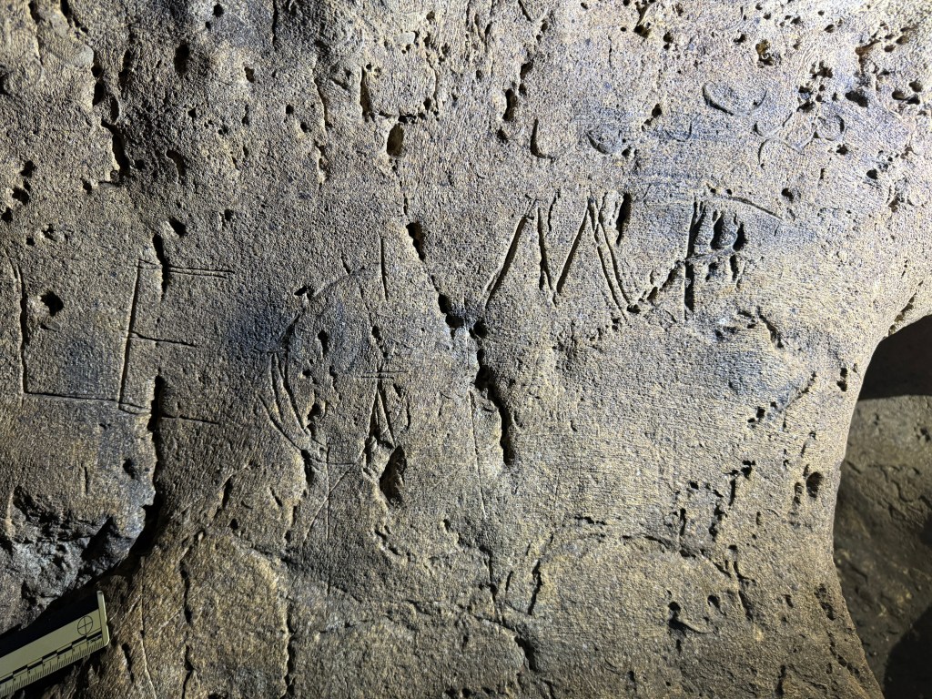 Carvings can be particularly hard to remove without further damaging the cave. Congrats to these losers for their subpar artwork.